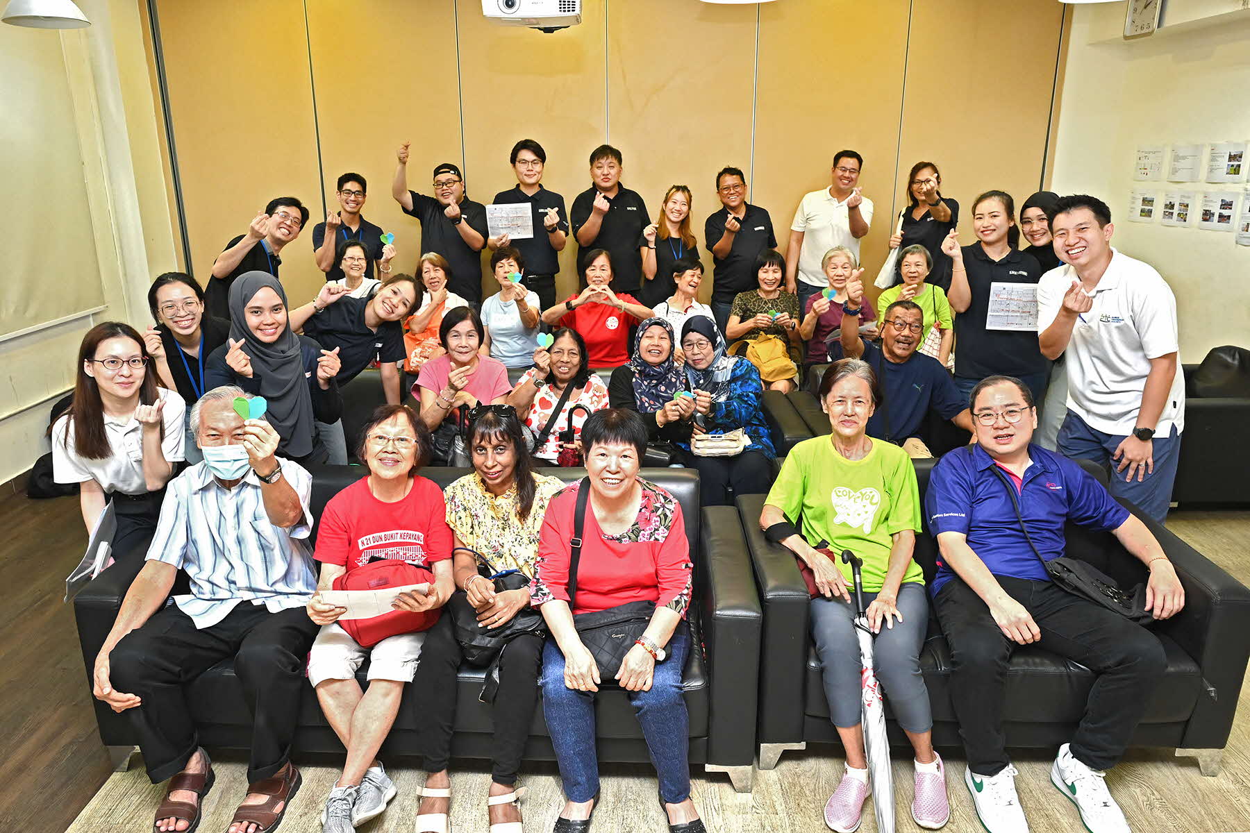 A group photo of the corporate volunteers and elderlies from Care Corner Singapore